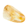 Photographie d’une pierre de citrine jaune doré, lumineuse et translucide, aux reflets solaires chauds, posée sur un fond clair. Symbole de joie, d’abondance et d’énergie positive.